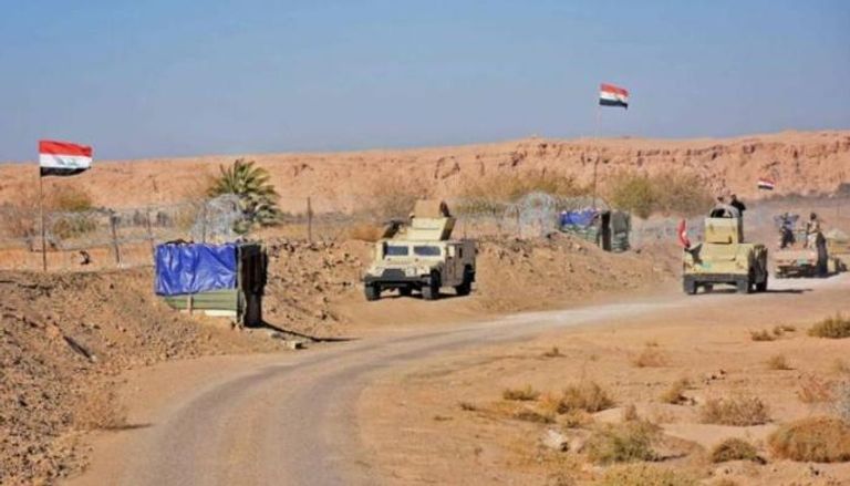 قوات عراقية تتجمع بالقرب من معبر القائم الحدودي بين سوريا والعراق - الفرنسية