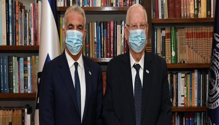 الرئيس الإسرائيلي وزعيم المعارضة يائير لابيد