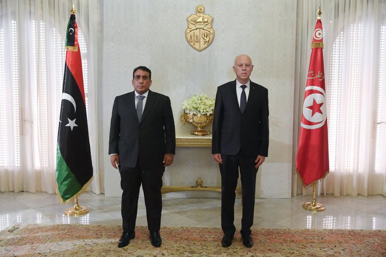 الرئيس التونسي قيس سعيد ورئيس المجلس الرئاسي الليبي محمد المنفي
