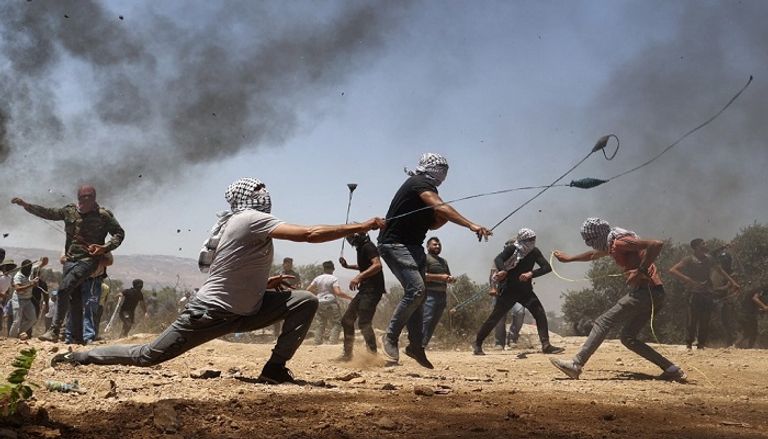 جانب من المواجهات التي أندلعت بين الفلسطينيين والإسرائيليين بسبب مستوطنة "أفيتار"