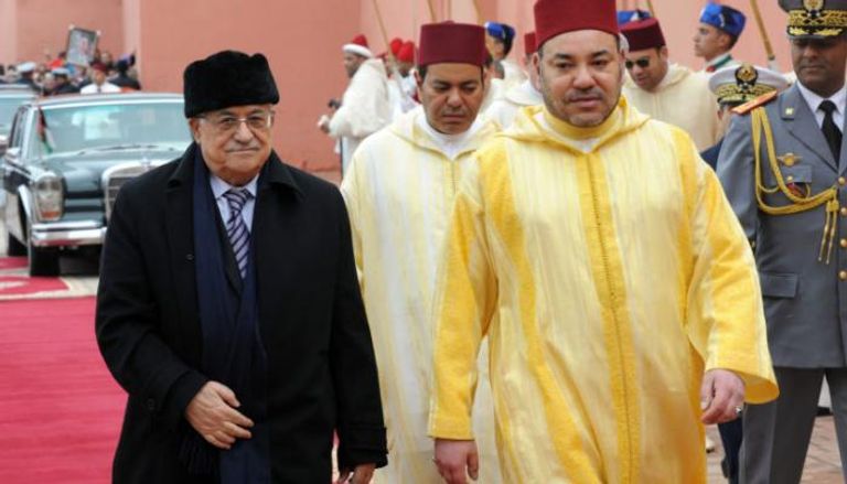 الملك محمد السادس والرئيس محمود عباس