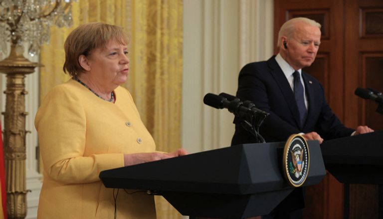ميركل وبايدن خلال المؤتمر الصحفي ميركل خلال لقاء بايدن في البيت الأبيض - أ.ف.ب