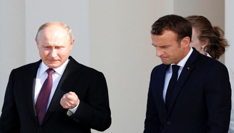 الرئيس الفرنسي ونظيره الروسي - أ.ف.ب