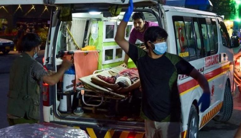 نقل الجرحى جراء تفجيري مطار كابول - أ.ف.ب الرئيس الأمريكي جو بايدن - رويترز