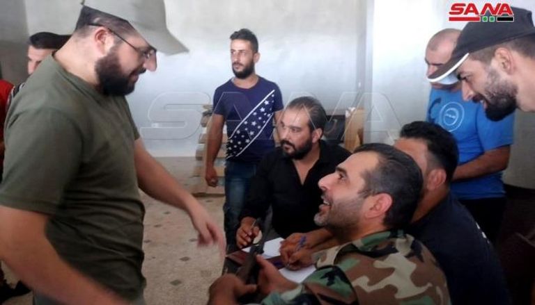 تسليم أسلحة وتسوية أوضاع عدد من مسلحي درعا -الوكالة السورية