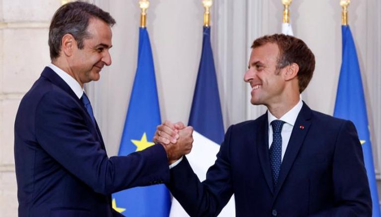 الرئيس الفرنسي ورئيس الوزراء اليوناني- الفرنسية