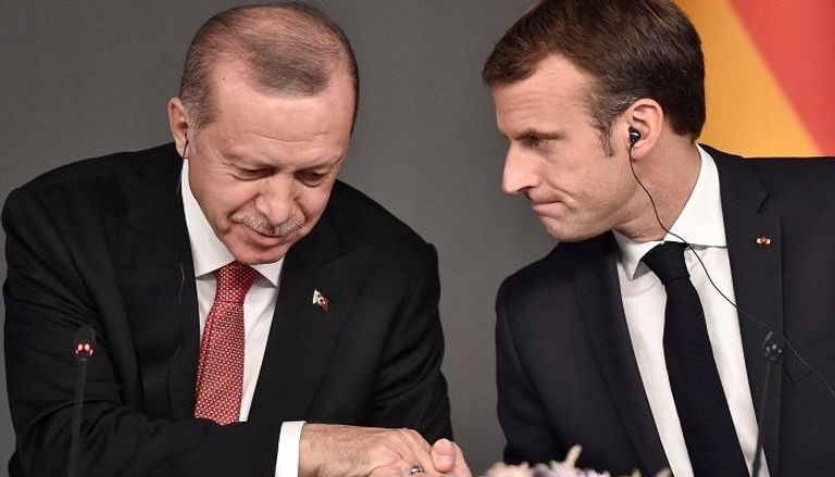 ماكرون وأردوغان خلال لقاء سابق
