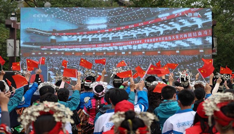 شاشة تعرض كلمة الرئيس الصيني في أحد شوارع بكين