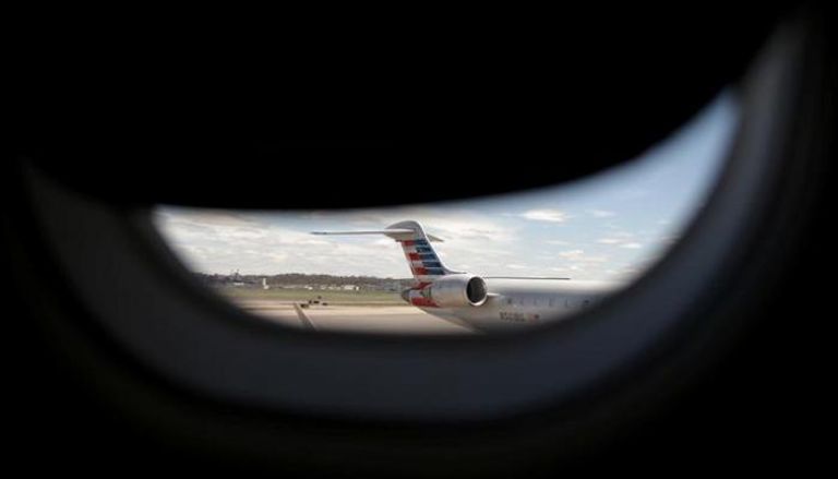 طائرة في مطار ريجان الدولي - رويترز