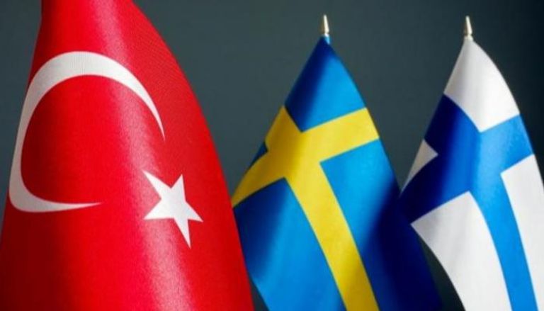 أعلام تركيا والسويد وفنلندا - أرشيفية