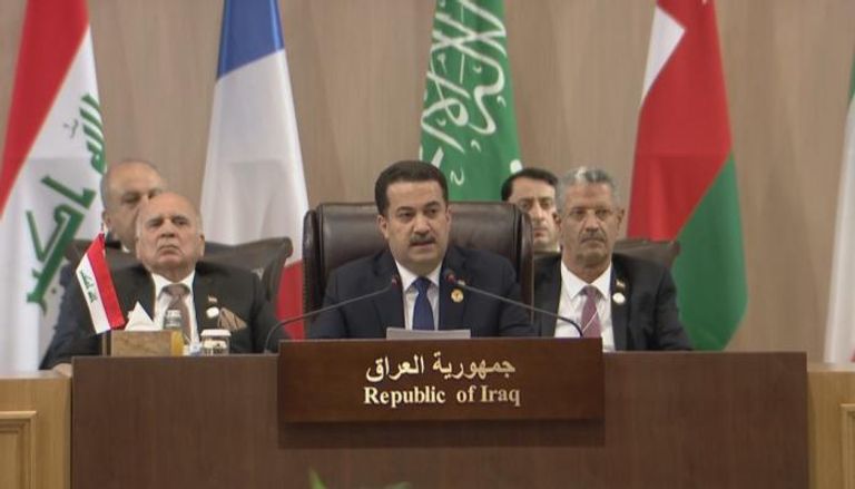 رئيس الوزراء العراقي محمد شياع السوداني في مؤتمر 
