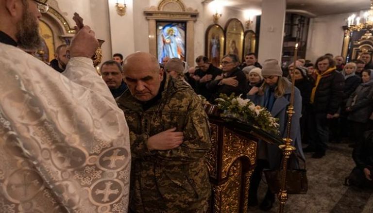 أوكرانيون يحتلفون بعيد الميلاد في 25 ديسمبر/ كانون الأول