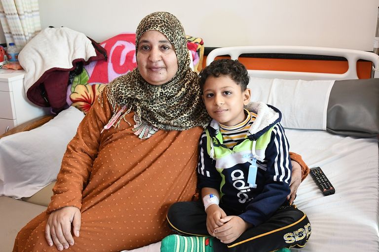 Boy Salah Al-Sayed with his mother