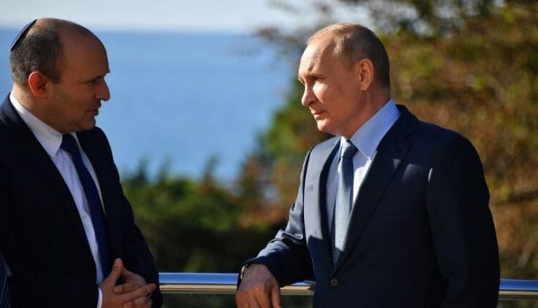 بوتين وبينيت خلال لقاء سابق