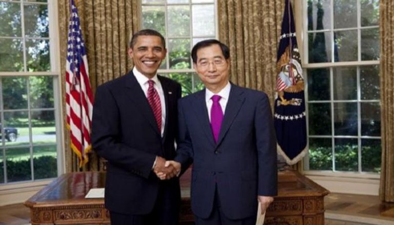 هان دوك-سو خلال تواجده برفقة الرئيس الأمريكي الأسبق باراك أوباما