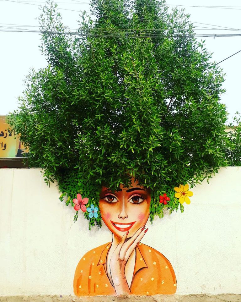 تزيين زقاق قديم بمنطقة الكاظمية برسومات فلكلورية