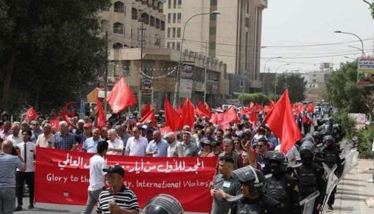 تظاهرة لنقابة العمال العراقيين وسط بغداد في يومهم العالمي