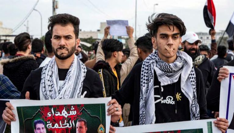 مظاهرة تندد باغتيال الصحفيين بسلاح المليشيات في العراق