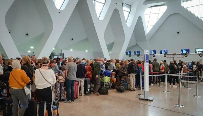 مسافرون في مطار مراكش في مارس/ آذار 2020 قبل إغلاق المطارات