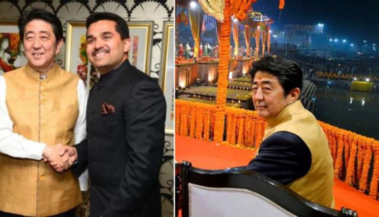 شينزو آبي مع رجل أعمال هندي مرتديًا سترة ذهبية