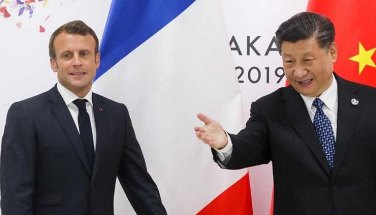 الرئيسان الفرنسي والصيني في لقاء سابق - أرشيفية