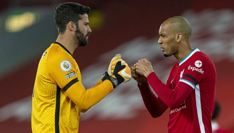 أليسون بيكر وفابينيو محمد صلاح نجم ليفربول ضد مانشستر يونايتد - أرشيفية