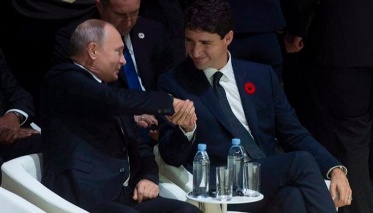 لقاء قديم يجمع الرئيس الروسي فلاديمير بوتين ورئيس وزراء كندا جاستن ترودو 