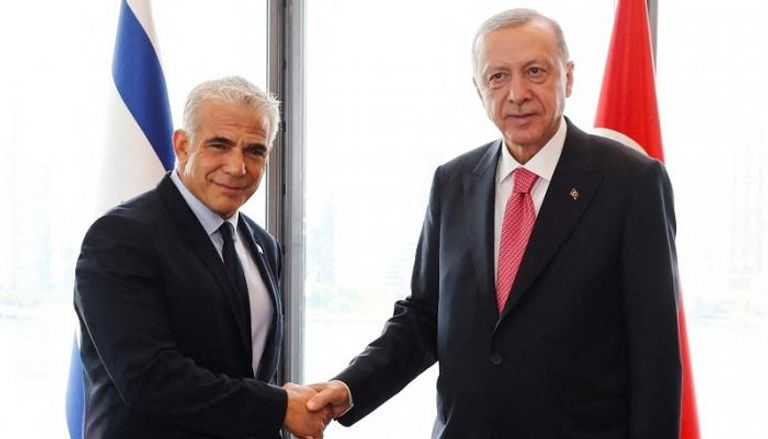 الرئيس التركي رجب طيب أردوغان ورئيس الوزراء الإسرائيلي يائير لابيد- رويترز