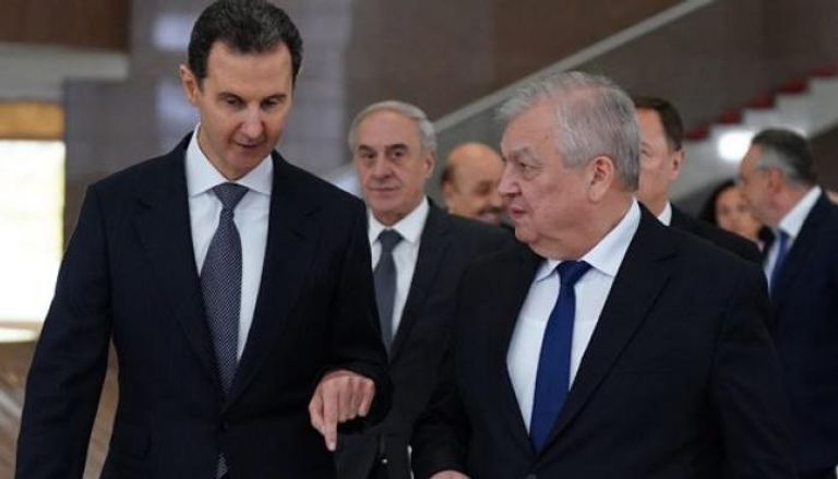 الرئيس السوري بشار الأسد مع المبعوث الروسي