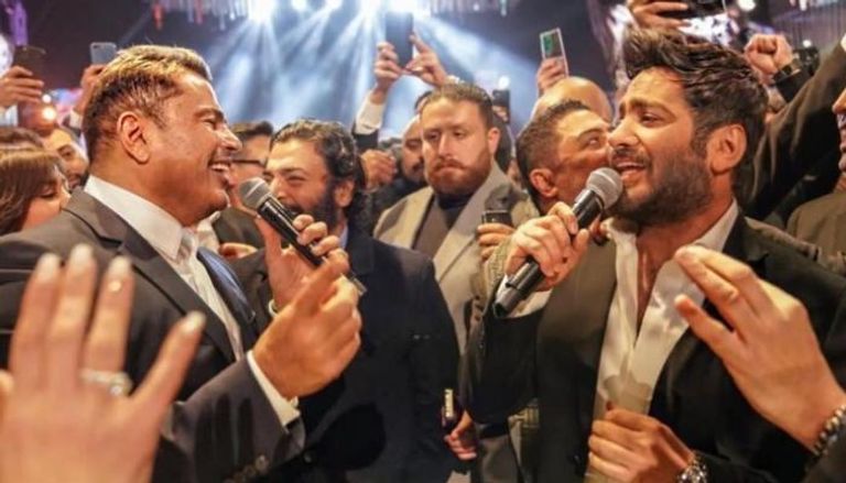 عمرو دياب وتامر حسني خلال حفل زفاف أحمد عصام