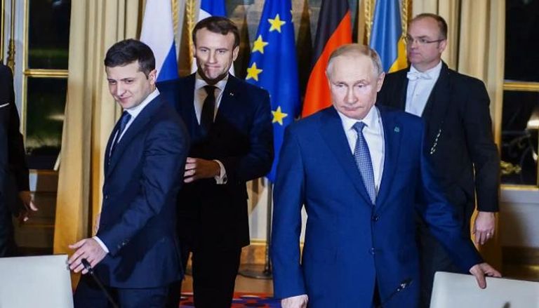 الرئيس زيلينسكي ونظيراه الفرنسي ماكرون والروسي بوتين في قمة نورماندي