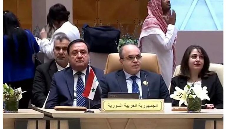 الوفد السوري خلال الاجتماع