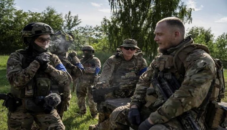 أعضاء من الفيلق التطوعي الروسي وسط الهجوم على أوكرانيا  - رويترز