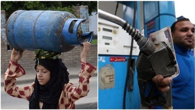 عامل يحمل أنبوبة غاز