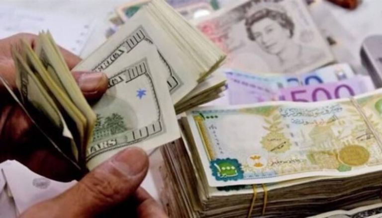 الليرة السورية والدولار الأمريكي