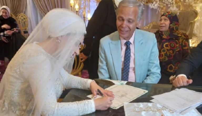 محمود عامر ورشا فرج في زفافهما