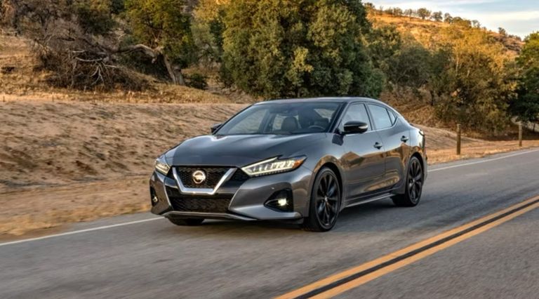 طراز Nissan Maxima SV طراز Porsche 718 Cayman