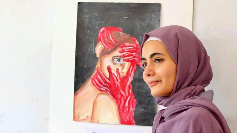 لوحة تعبر عن العنف ضد المرأة في اليمن