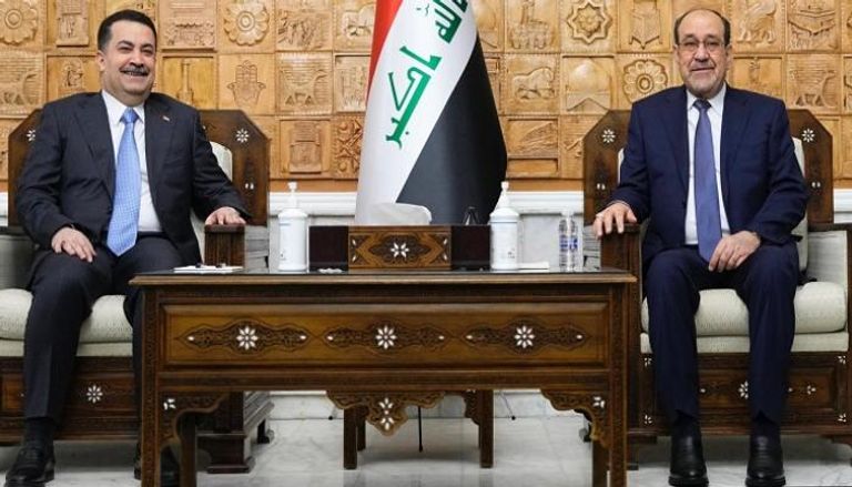 محمد شياع السوداني (يسار) ونوري المالكي (يمين)