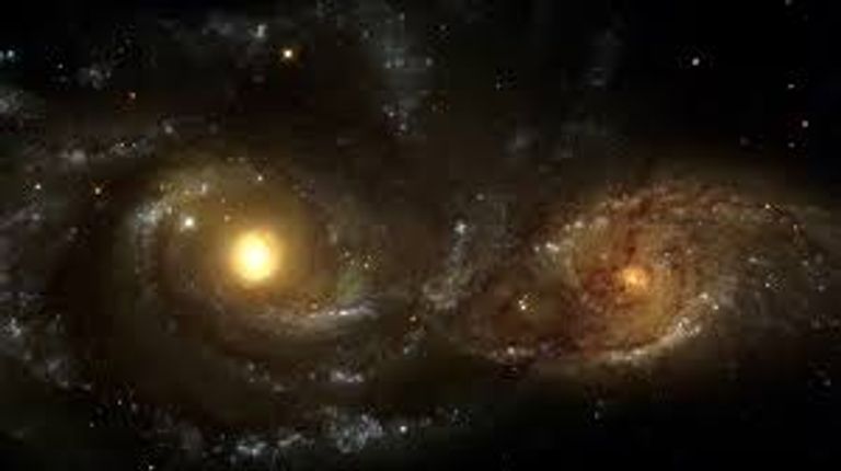 مشهد نادر لتصادم مجرتين حلزونيتين