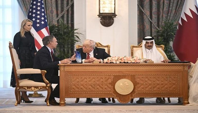 الرئيس الأمريكي وأمير قطر - أ ف ب