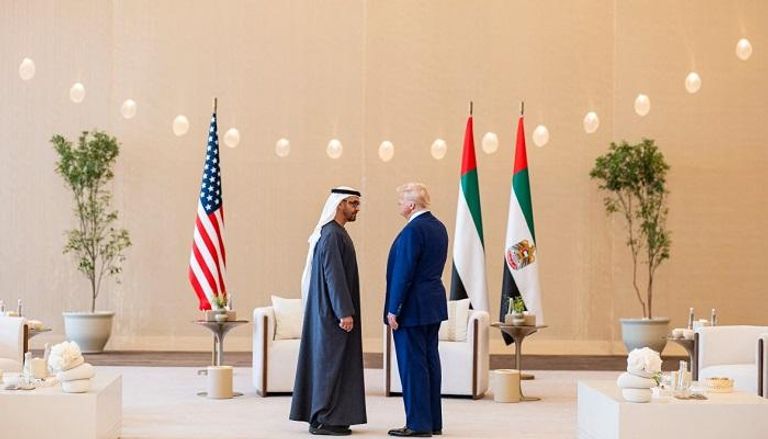 الشيخ محمد بن زايد آل نهيان والرئيس دونالد ترامب - أ ف ب