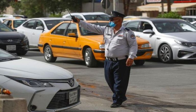 شرطي مرور ينقذ طفلا مريضا في العراق- أرشيفية
