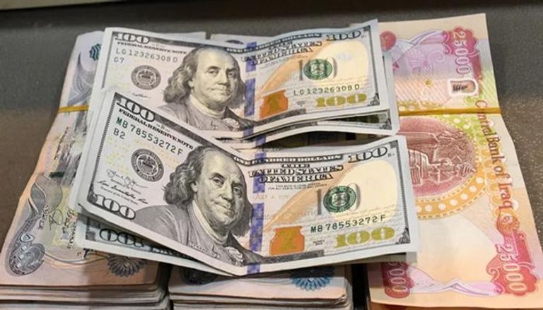 الدينار العراقي والدولار الأمريكي - تعبيرية