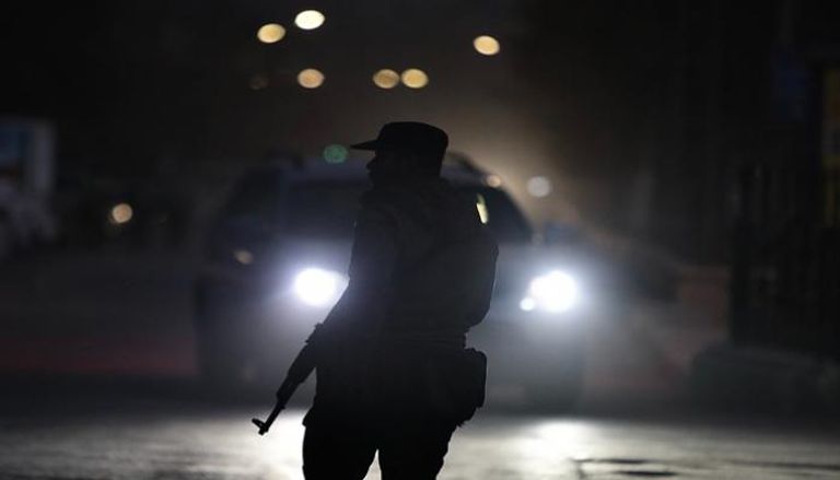 ، أحد أفراد قوات الأمن المنتشرة قرب حيّي الشيخ مقصود والأشرفية في حلب