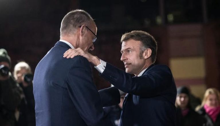 ماكرون وميرتس في لقاء سابق