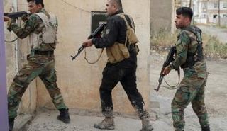  صورة أرشيفية لمقاتلين أكراد (رويترز)