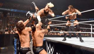 نزال بين إيه جيه ستايلز وكارل أندرسون وبين إنزو أموري وكولين كاسادي