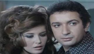 نور الشريف وميرفت أمين في فيلم الحفيد