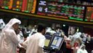 بورصة أبوظبي تتمسك بـ "الأخضر".. و"دبي" تغلق منخفضة